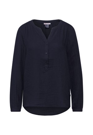 Blouse marine à manches longues avec un col en V, patte de boutonnage, tissu texturé, ourlet arrondi et lignes verticales subtiles.