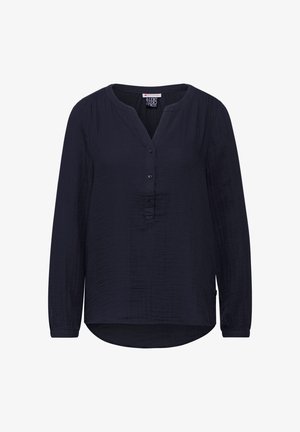 Marineblå bluse med lange ærmer, V-udskæring, knaplukning, struktureret stof, afrundet kant og subtile lodrette linjer.