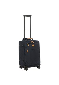 Valigia soft-shell blu navy con manico retrattile, quattro ruote girevoli, dettagli color beige e tasche esterne con zip per ulteriore spazio di stoccaggio.