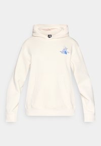 Hoodie boje kreme izrađena od mekanog materijala, s prednjim džepom i plavim logotipom na lijevoj strani prsa, s kapuljačom na vezanje.