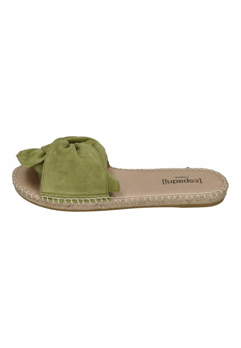 Green suede slide sandal with twisted bow detail, jute trim around the sole, and a flat footbed. Soft texture and casual design.