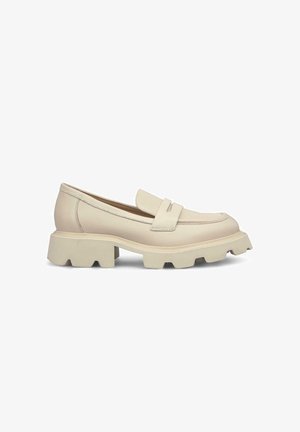 Beige leather loafer with a rounded toe and a thick, textured sole. Features a decorative strap across the vamp and stitching details.