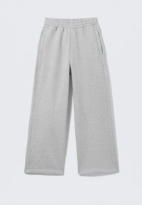 Lysegrå bomulds joggingbukser med elastisk taljebånd, to sidelommer og bredt ben design. Blød tekstur og enkle syningsdetaljer.