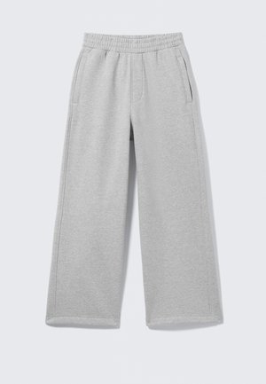 Lysegrå bomulds joggingbukser med elastisk taljebånd, to sidelommer og bredt ben design. Blød tekstur og enkle syningsdetaljer.