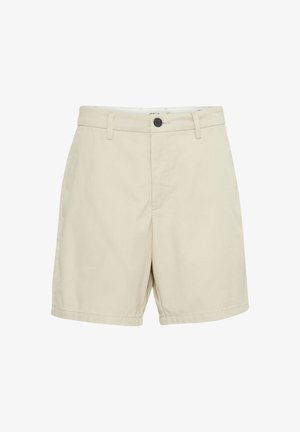 Beige knæshorts i knælang længde med knaplukning, bæltestropper og sidelommer, vist på en hvid baggrund.