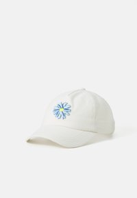 White cotton baseball cap featuring an embroidered blue flower with a yellow center on the front. Curved brim and stitched detailing.