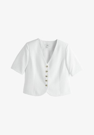 Fehér rövid ujjú blézer öt teknőspáncéllal díszített gombbal az elején és V-nyakú gallérral.