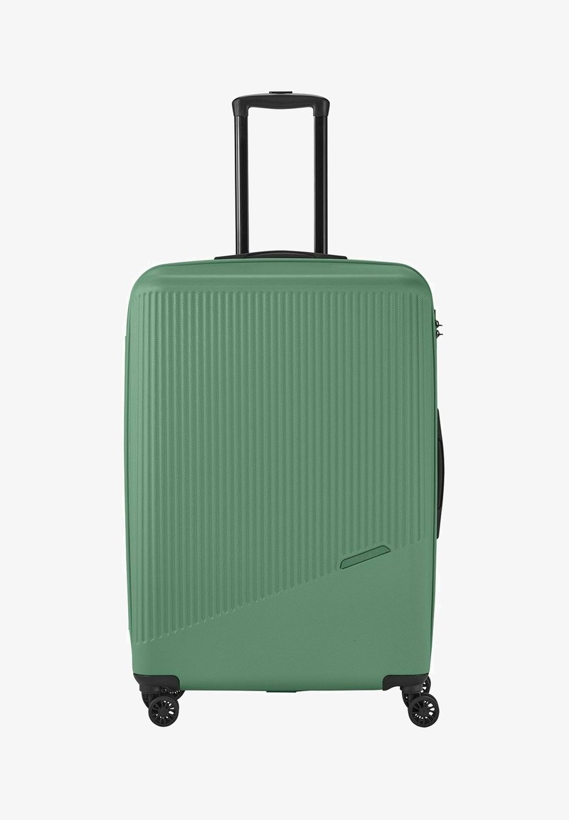 Hard-shell suitcase in mint green with vertical ribbed texture. Features a black telescopic handle and four black wheels for mobility.