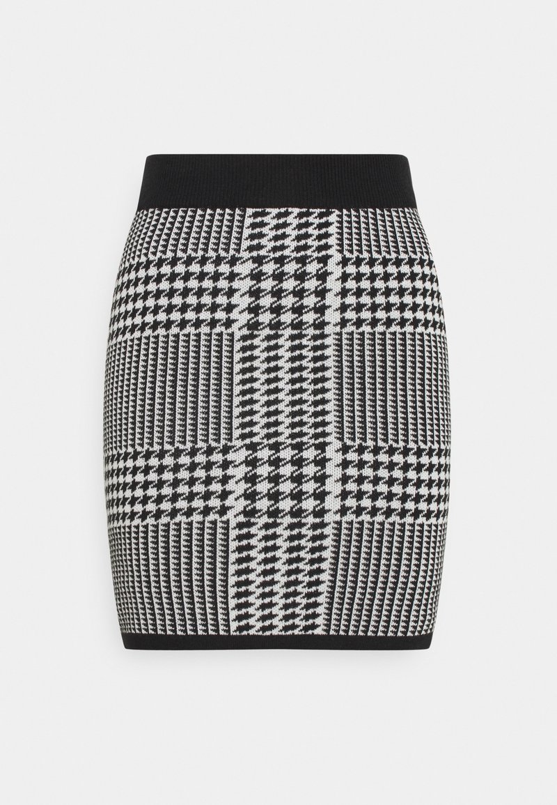 Jupe en maille à motif pied-de-poule noir et blanc, forme ajustée avec taille et ourlet élastiques noirs.
