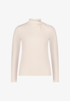 Langarmshirt aus weichem beigen Stoff mit einem hohen Kragen und einem gedrehten Akzent auf der linken Schulter. Glattes, körperbetontes Design.