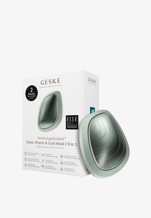 Masque Sonic Warm & Cool en vert doux, présentant un design lisse et incurvé avec une forme ergonomique. La boîte met en avant la technologie et les avantages.