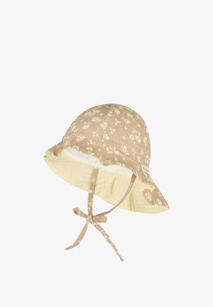 Beige baby sun hat with small floral prints, wide brim, soft fabric lining, and adjustable chin straps tied in a bow.