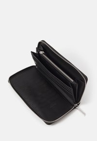 Black leather wallet with silver zipper, multiple card slots, and a zippered compartment for coins or cash. Smooth texture and compact design.