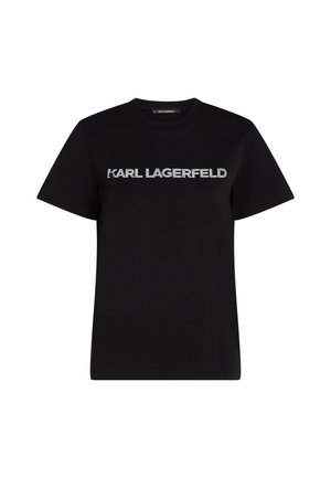 Črna bombažna majica s krožnim ovratnikom in kratkimi rokavi. Ima izjemno značilen srebrn logotip "KARL LAGERFELD" čez sprednji del.