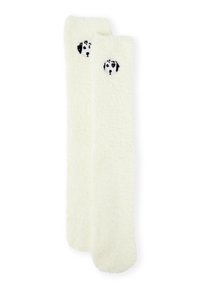 Weiche, cremefarbene Socken mit stickiertem Hunde-Porträt in Schwarz. Weiche Textur, knielang. Keine sichtbaren Muster oder Verzierungen.