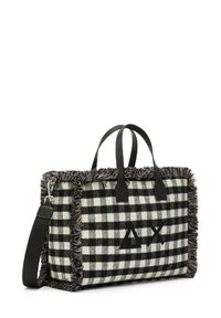 Borsa a tracolla a quadri bianco e nero con bordi frangiati, manici in pelle e un logo con forme geometriche sul davanti. Inclusa tracolla regolabile.