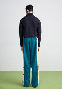 adidas Originals ADIBREAK - Pantalones deportivos - legacy teal