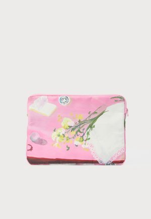 Pink laptop sleeve featuring floral design, book, and lace detail. Smooth fabric with zipper closure. Accents include a circular pattern.