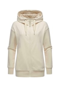 Haut à capuche zippé beige clair avec une capuche spacieuse, des cordons de serrage, deux poches latérales, des poignets côtelés et une texture douce et lisse.