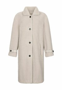 Long manteau beige clair en fausse toison avec boutons noirs, poches latérales, col et sangles de poignet ajustables.