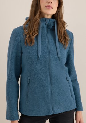 Veste en polaire teal, avec une fermeture éclair à l'avant, une capuche avec cordon de serrage et deux poches latérales à fermeture éclair. Texture douce avec une coupe décontractée.