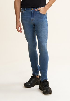 IN BULL ELASTICIZZATO - Pantalones - jeans chiaro-cuciture beige