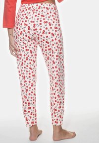 Lätta, rosa pyjamasbyxor med körsbärsmönster. Har resårmidja och avsmalnande ben med ankelmanschetter.