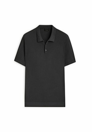 Polo noir à manches courtes en tissu texturé, avec patte de boutonnage à deux boutons, col et ourlet côtelés, posé à plat sur un fond blanc.
