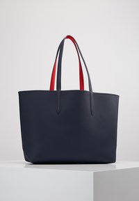 lacoste reversible tote