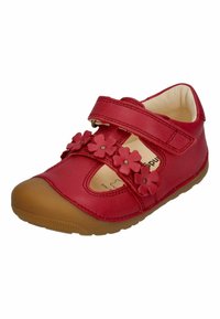 Red leather Mary Jane shoe with floral accents, brown rubber sole, Velcro strap, and cut-out design for breathability and comfort.
