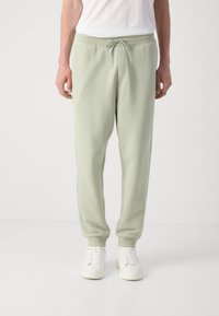 HUGO NOMPIO - Donji dijelovi trenirke - light/pastel green