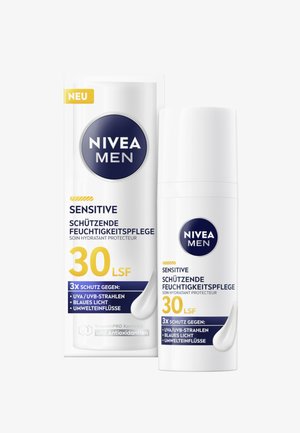 Moisturizer bottle labeled "NIVEA MEN SENSITIVE" in white and dark blue, features SPF 30, protection claims, and a smooth design.