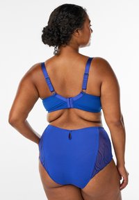Blue bikini top and bottom set featuring adjustable straps, textured detailing on the sides, with a keyhole accent on the back of the bottom.