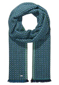 Écharpe tricotée à carreaux bleus, verts et noirs avec des extrémités à franges, disposée en boucle avec les deux extrémités pendantes.