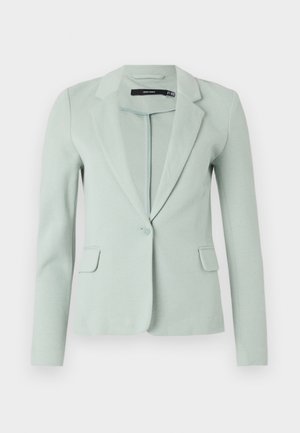 Lichtgroene blazer van soepel materiaal, met een gelapte revers, enkele knoopsluiting en twee voorzakken. Lange mouwen.