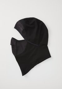 Un masque balaclava noir avec une zone de bouche perforée et respirante, et le logo "Mammut" sur le côté, conçu pour une protection en extérieur.