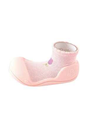 Scarpina calzino rosa per bambino con suola flessibile e punta rinforzata, con un piccolo motivo di fiore viola sulla parte superiore del calzino.