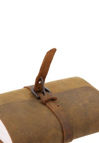 Brown leather notebook with a textured surface, secured by a metal clasp and a leather strap. Features a tan suede tab for closure.