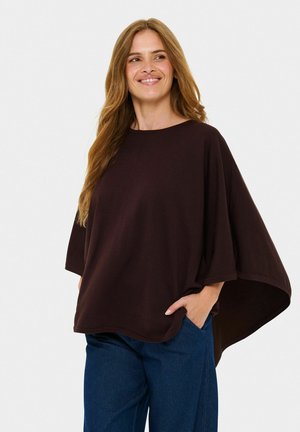 Dark brown oversized top with a wide neckline and short sleeves, featuring a textured finish and a loose, flowing silhouette.
