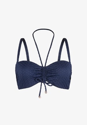 Námořnická modrá bikiny vršek s texturovanou tkaninou v zigzagovém vzoru. Obsahuje nastavitelné tenké ramínka a přední vázání s dekorativními akcenty.