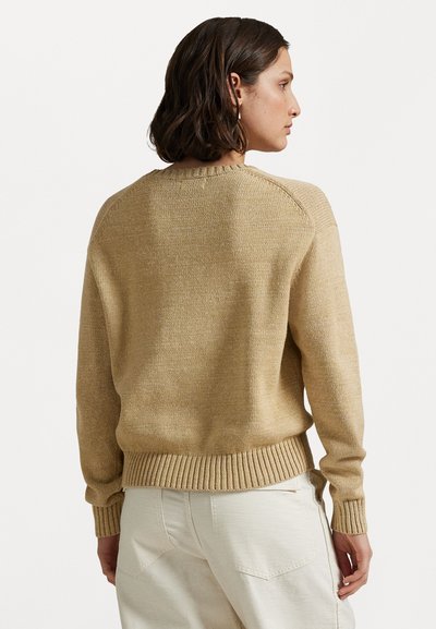 Gebreid sweater in lichtbeige, met een ronde halslijn, geribbelde zoom en lange mouwen met raglannaden. Gelaagd, zacht materiaal.