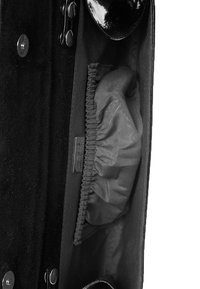 Black leather clutch with a smooth exterior, featuring a satin-lined interior and a gathered pocket for organization. Silver hardware accents visible.