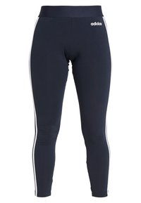 Navy blue leggings with a fitted design, made of stretchy fabric. Features white side stripes and an elastic waistband with an adidas logo.