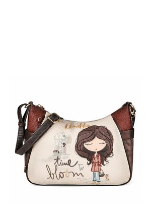 Sac à main avec une fille de dessin animé tenant un panier, petit chat, accents marron et la phrase "time to bloom" sur le devant.