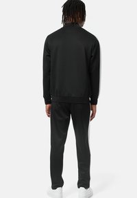 Lonsdale NORMALE PASSFORM MANHAY - Treniņtērps - black white