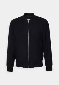 Giubbotto bomber nero con colletto rotondo, chiusura frontale con zip e polsini e orlo a coste. Realizzato in materiale liscio con un design minimalista.