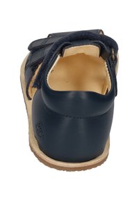Navy leather sandal with a smooth finish, adjustable straps, and a soft beige inner lining. Features a durable tan rubber sole.