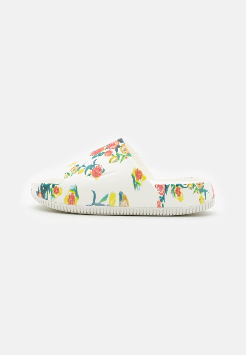 Floral-patterned slide sandal featuring a white base, a smooth texture, and a contoured design with a flat sole for comfort.