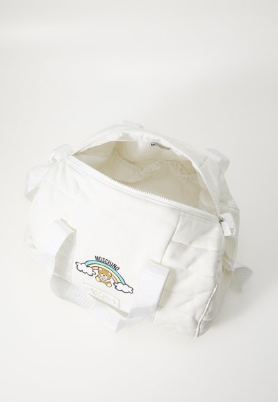 White quilted fabric bag with two short handles, zip closure, and a graphic design featuring a bear, rainbow, and clouds.