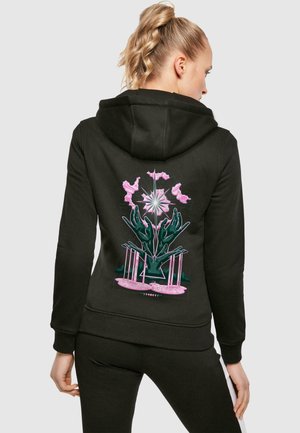 Black hoodie featuring a graphic design on the back, with pink floral and green hand elements, made of soft fabric, with a relaxed fit.